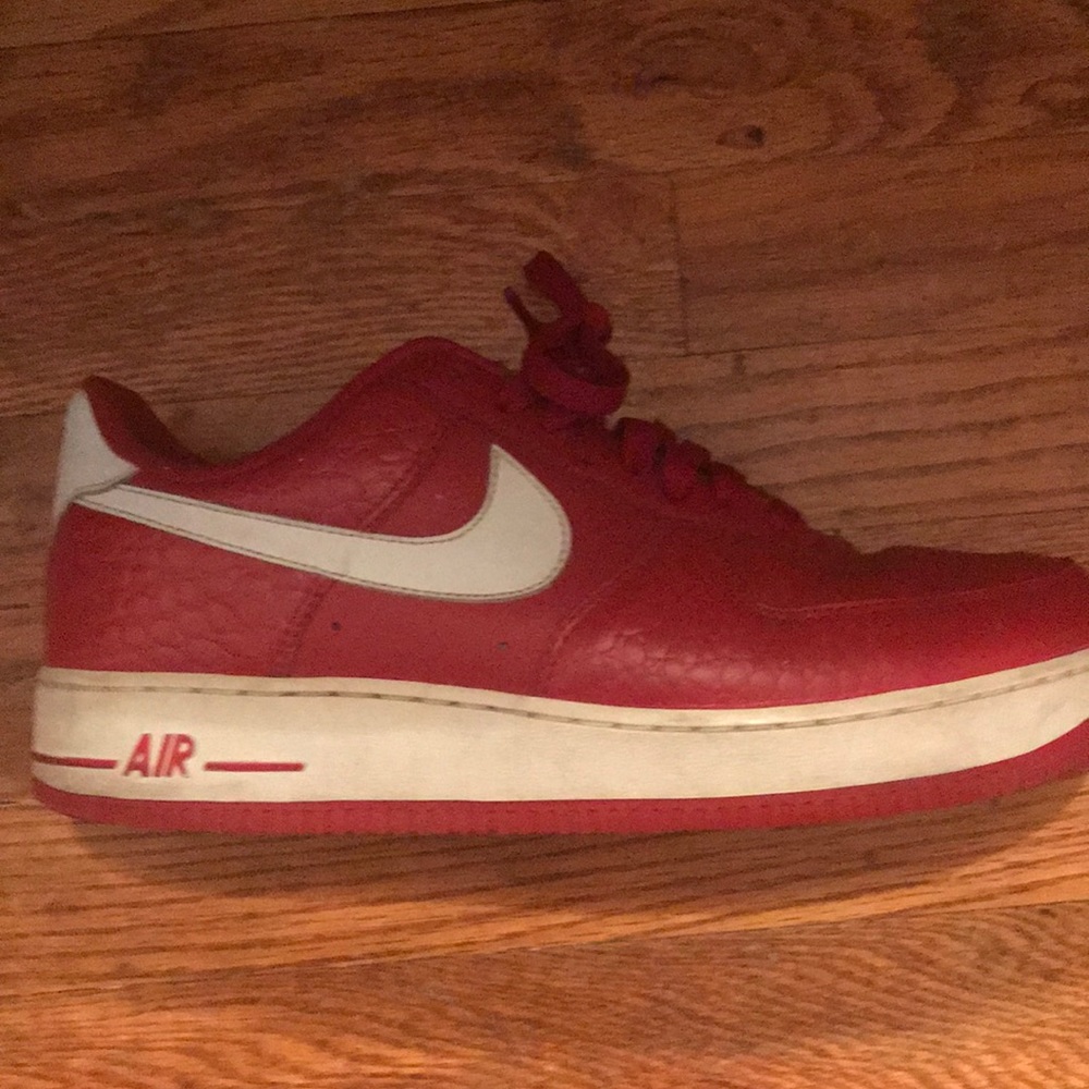 Red and white nike Air Force 1’s